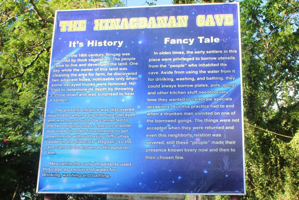 Sign with the history of Hinagdanan Cave