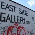 Photo of the Berlin Wall that reads "East Side Gallery" surrounded by graffiti.