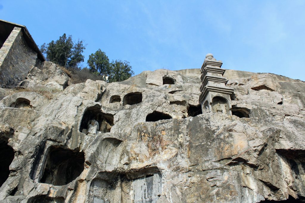 A collection of small caves on the west bank of the Longmen Grottoes