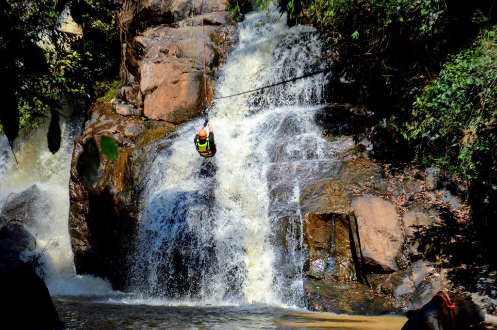 Photo of me ziplining waterfalls in Da Lat