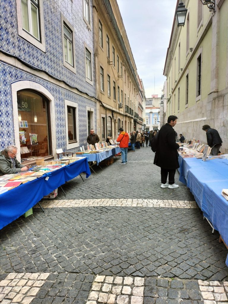 Photo of a street with book stalls lining both sides of the street.