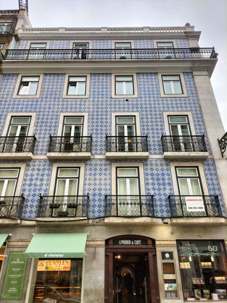 Photo of the facade of the building, covered in blue tiles.