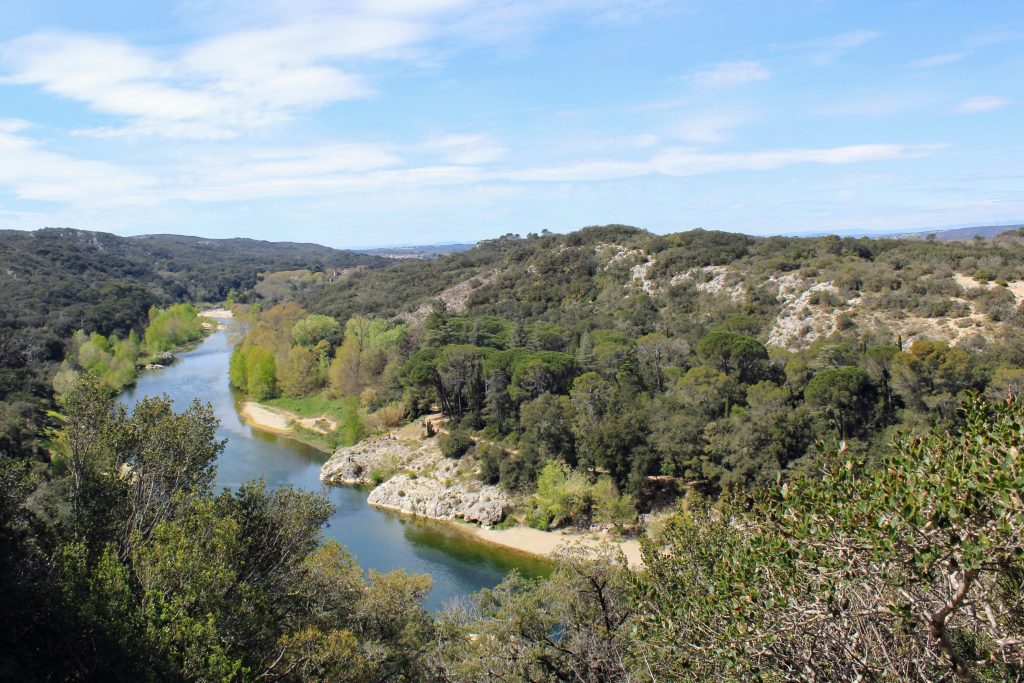 Photo of the river and surrounding hills.