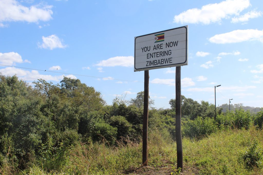 Photo of a sign saying "You are now entering Zimbabwe".