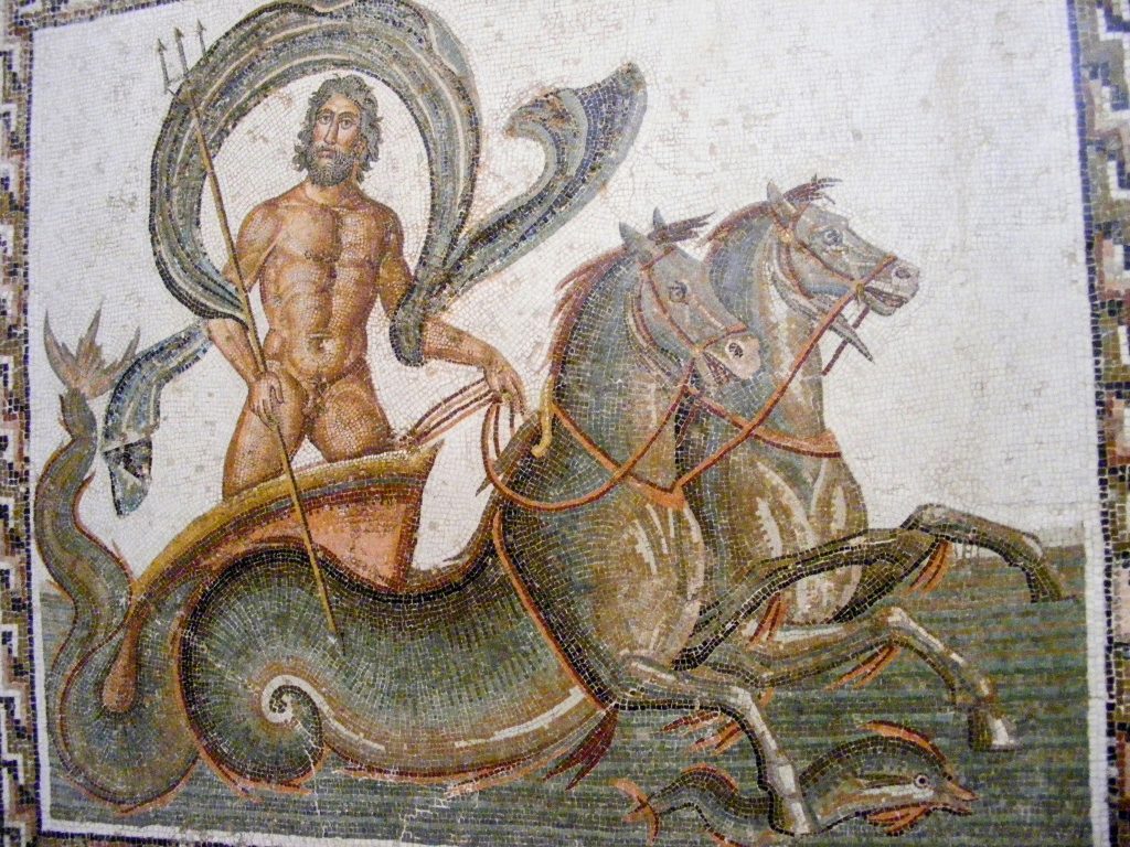 Mosaic of Neptune riding in a chariot pulled by two horses with tails for hind legs.