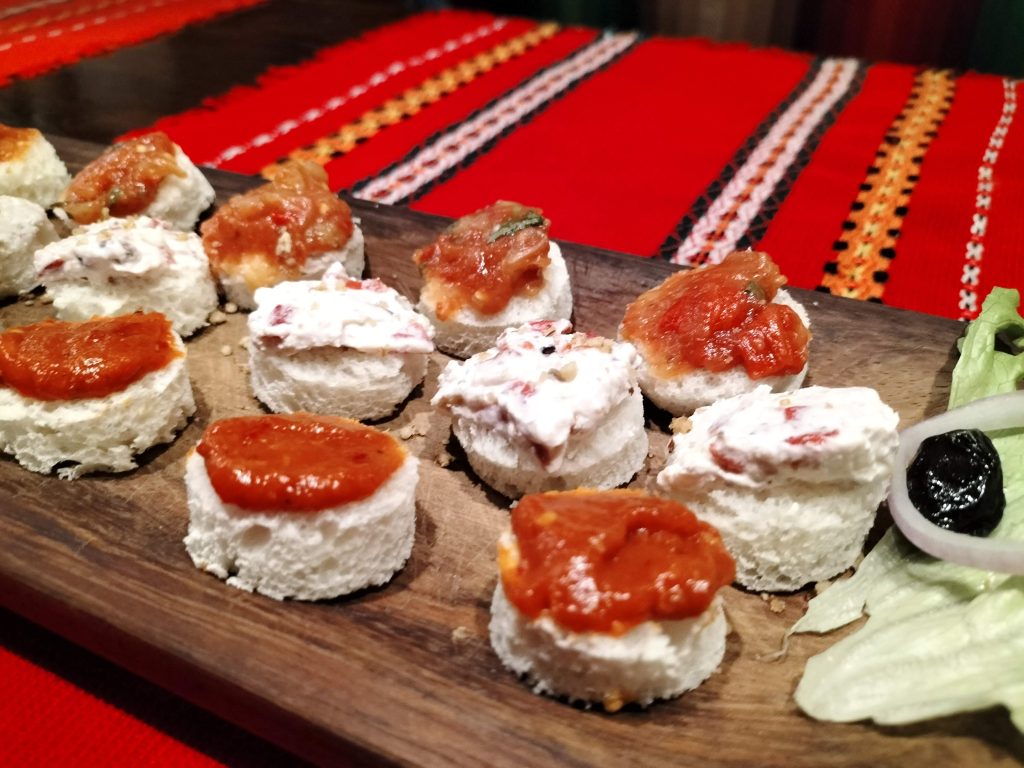 A trio of breads with different spreads on them.