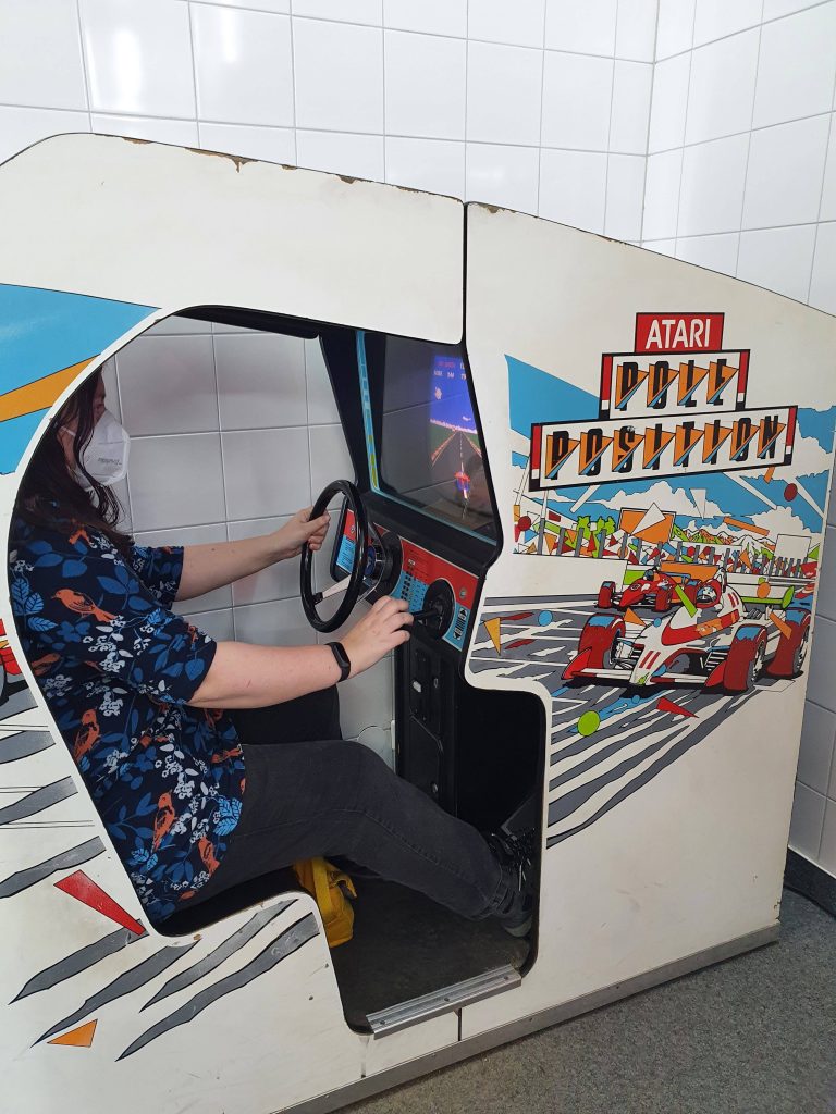Photo of pole position arcade game at the video game museum. 