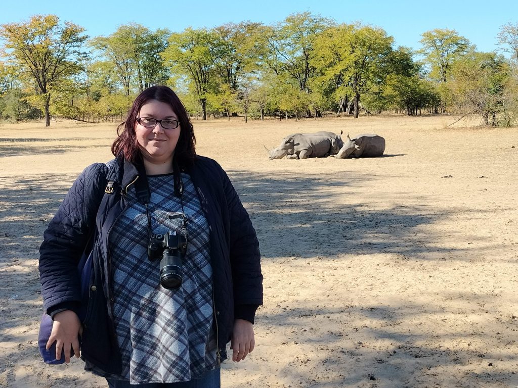 Photo of me on the rhino walk, with the rhinos not far in the background.